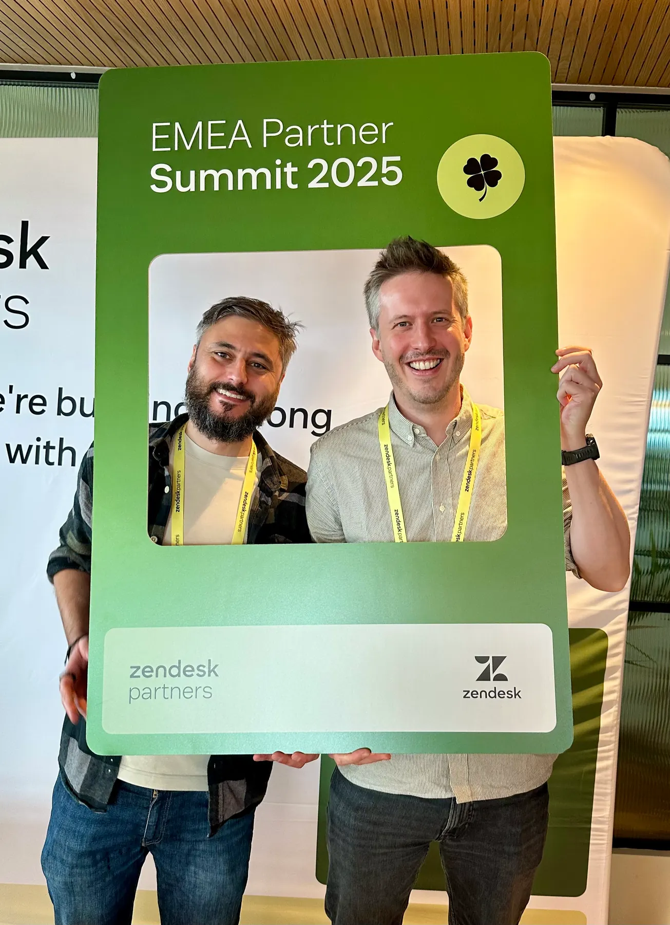 Two people posing inside a Zendesk EMEA Partner Summit frame in Dublin.