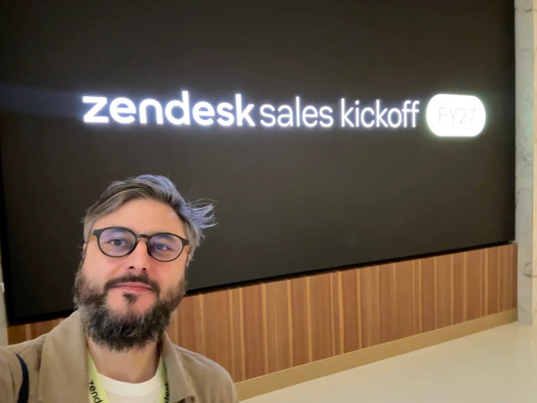 Selfie in front of a Zendesk Sales Kickoff sign in Las Vegas in 2026.